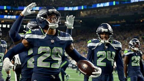 Josh Jobe celebrates after making an interception for the Seattle Seahawks against the New England Patriots