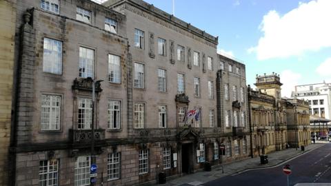 The exterior of Preston City Council, a large brown building.