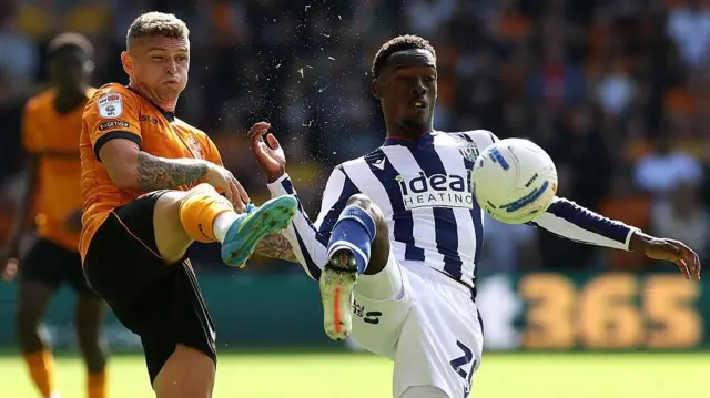 Kieran Trippier of Wolves challenges Rabby Nzingoula of West Brom for a bouncing ball.