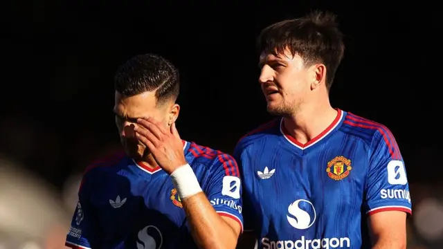 Diogo Dalot and Harry Maguire of Manchester United look dejected