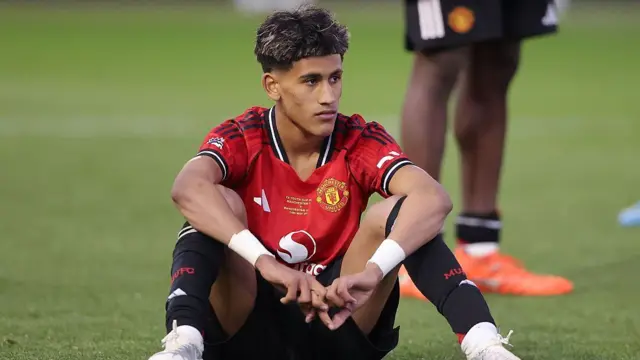 JJ Gabriel of Manchester United looks dejected