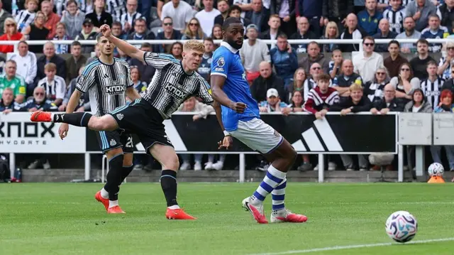 Lewis Hall scoring for Newcastle against Hull City at St James' Park