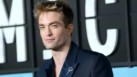 Robert Pattinson on red carpet at Mickey 17 premiere