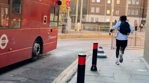 Jordan Izzett head-to-head with the 425 bus during a race. 