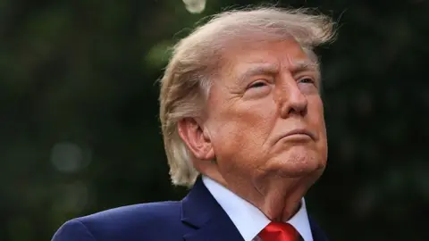 President Donald Trump pictured with a thoughtful look.