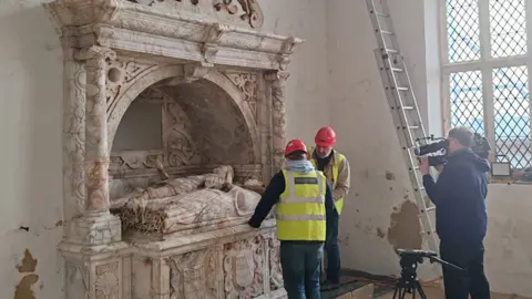 Skillington Workshop Ltd Conservationists are filmed examining the Grey monument