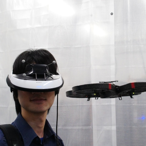 face Flying Head: A Head Motion Synchronization Mechanism for Unmanned Aerial Vehicle Control