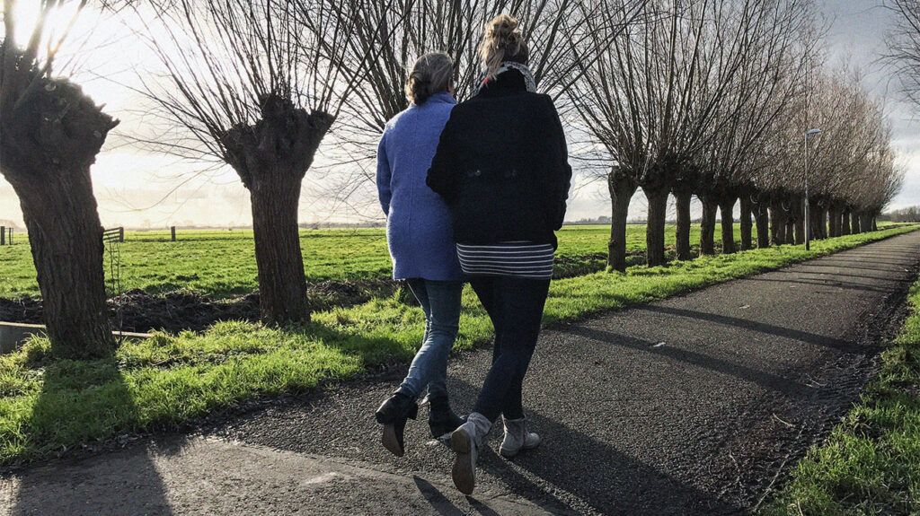 Two females walking outside