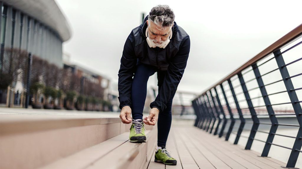 An older adult getting ready for a run.
