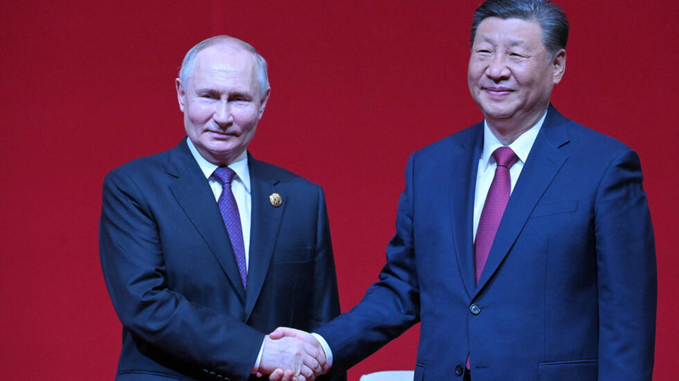 Russian President Vladimir Putin and Chinese President Xi Jinping shake hands at the gala event celebrating 75th anniversary of China-Russia relations in Beijing, China May 16, 2024