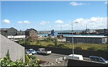 SH2482 : The A5 and the inner harbour from St Cybi's churchyard by Eric Jones