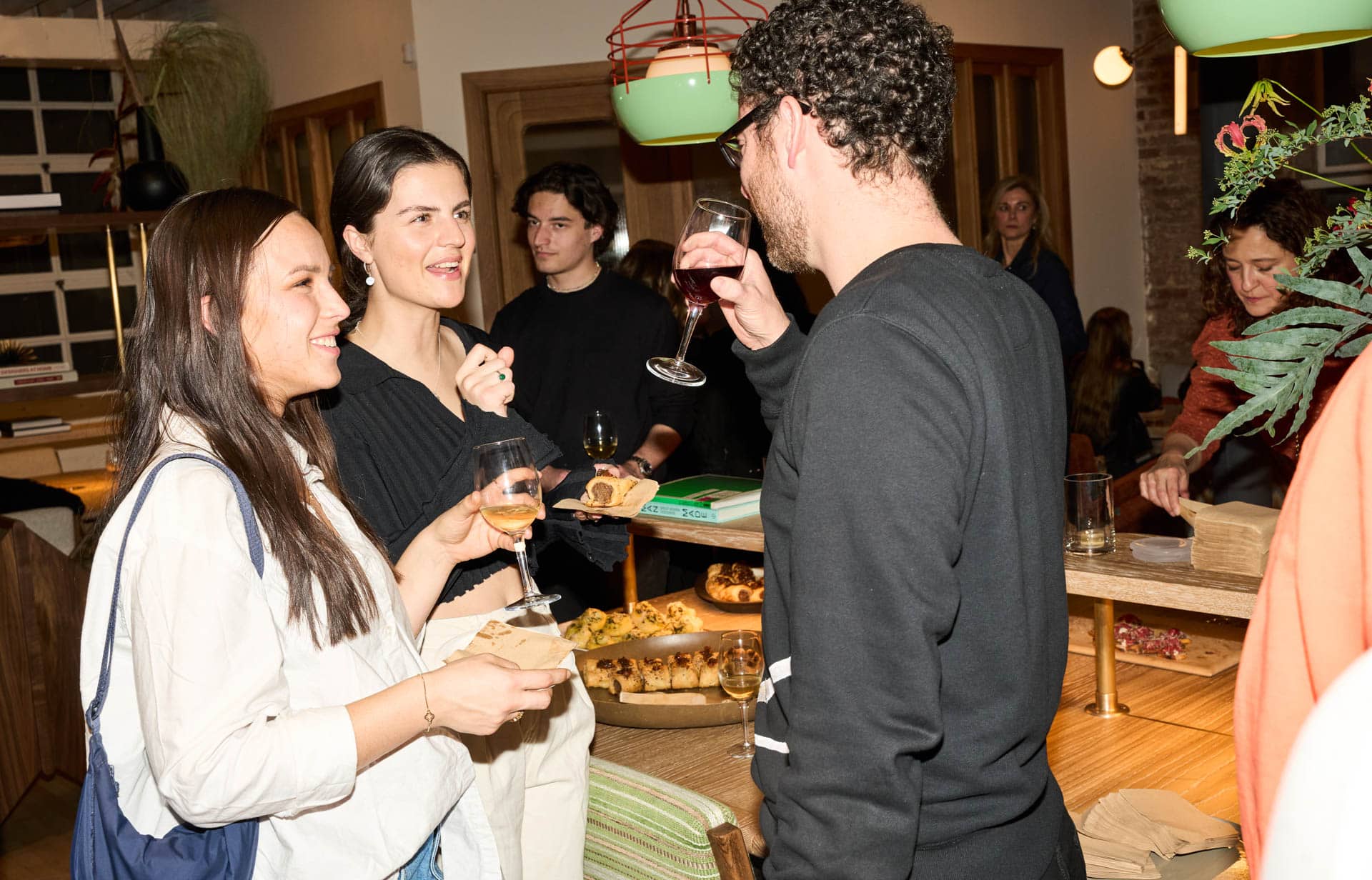 Guests mingling over wine at private event in The Malin