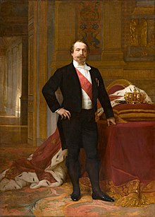 Napoleon III in his early fifties, posing for a portrait in his Grand Cabinet.