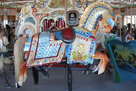 Un caballo de 1909 de Marcus Illions en el estilo Coney Island.