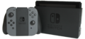 „Switch“ planšetė, įstatyta į doko stotelę ir „JoyCon“ pulteliai, sujungti į vieną