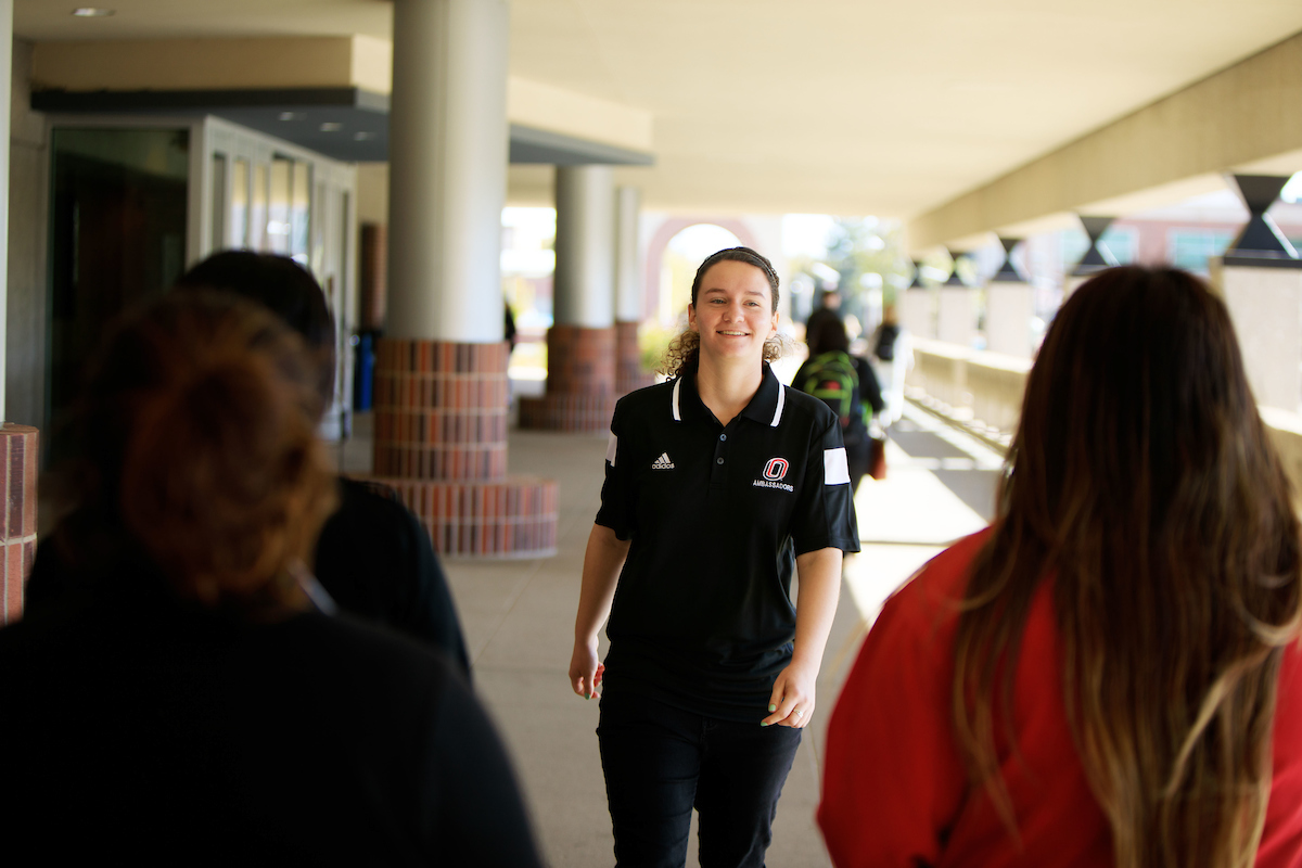 Students walking together on campus for a tour